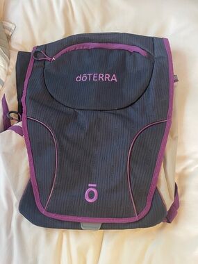 Doterra Black Backpack with Purple Trim and Logo